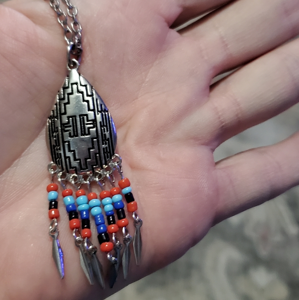Tribal design silver tone necklace